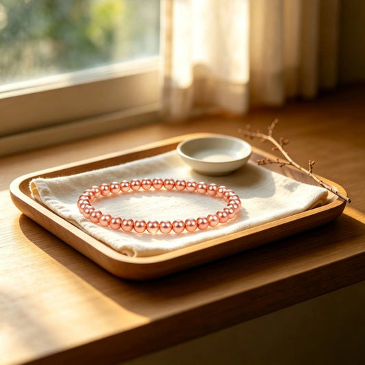 Solid copper beaded bracelet with 6mm raw copper beads on wooden tray by window