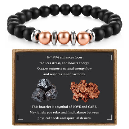 Matte hematite and copper beaded bracelet displayed with natural mineral meaning card