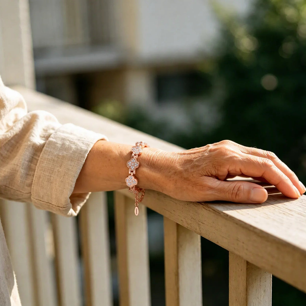 Woman wearing rose gold magnetic copper clover bracelet on wrist
